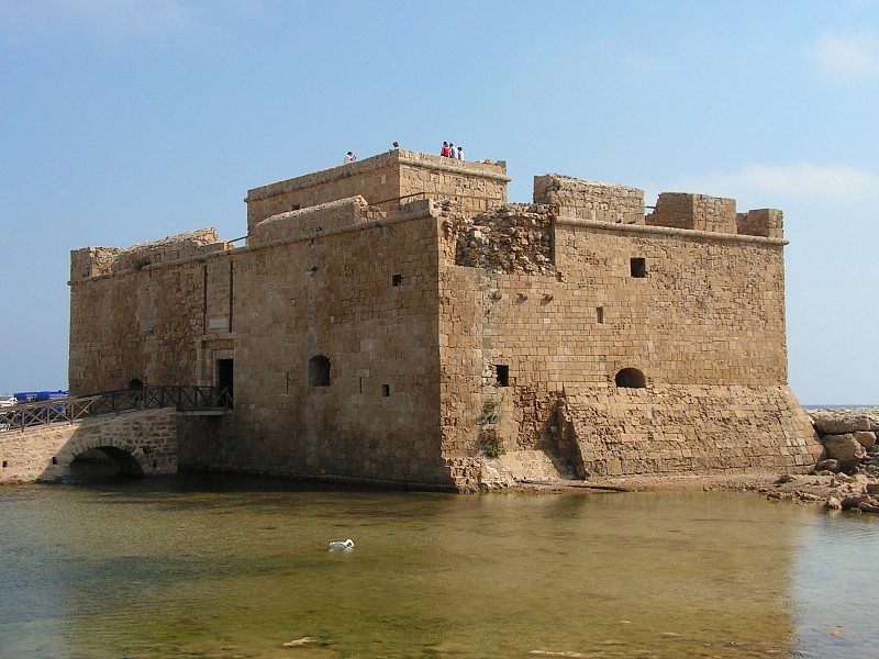 Paphos Castle at the end of the old harbour pier under a clear sky